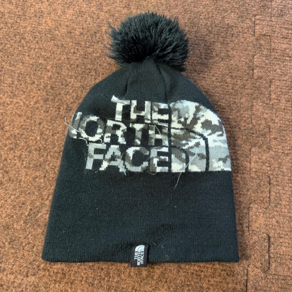 B- The North Face Youth Beanie Black Camo Logo Pom Pom Knit Hat Small S/P
